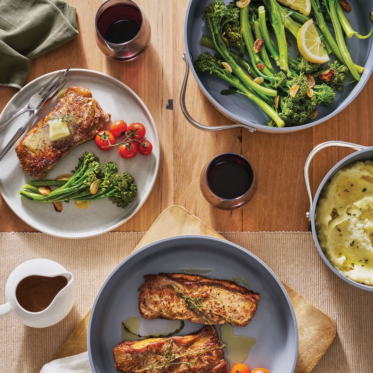 Nexgen 24cm/4.4 Litre Casserole on table with prok steaks and broccoli