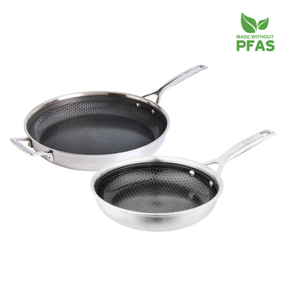 Two frying pans with a textured surface on a white background, featuring a label indicating they are made without PFAS.